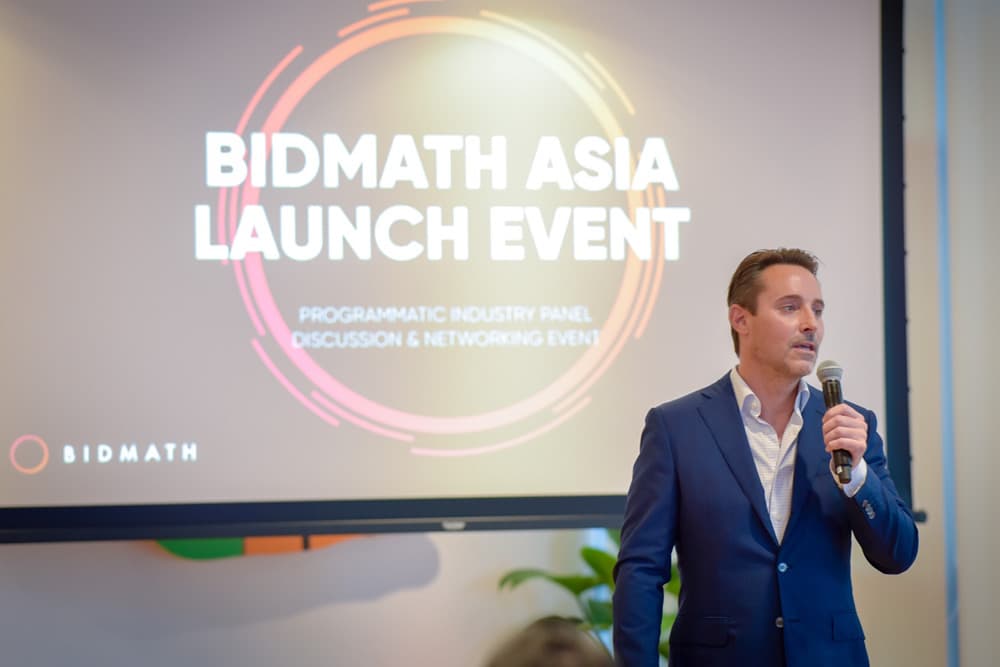 Bidmath Asia launch event title slide on a screen