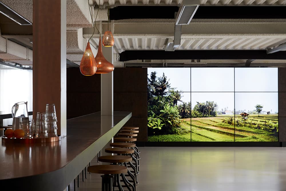 Meeting area with a long table and a large window view