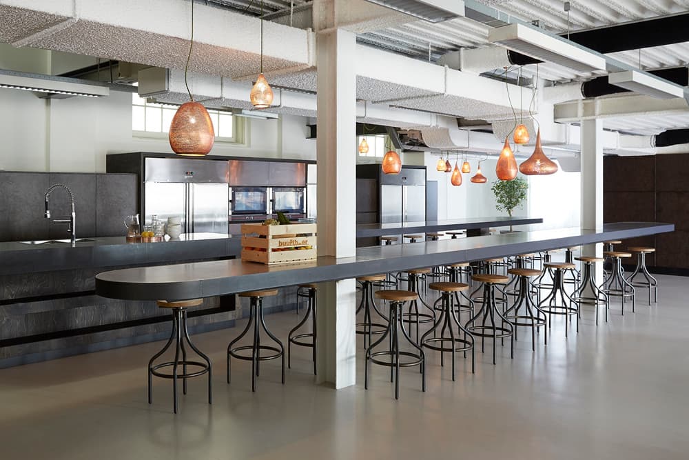 Office kitchen and bar area with high stools