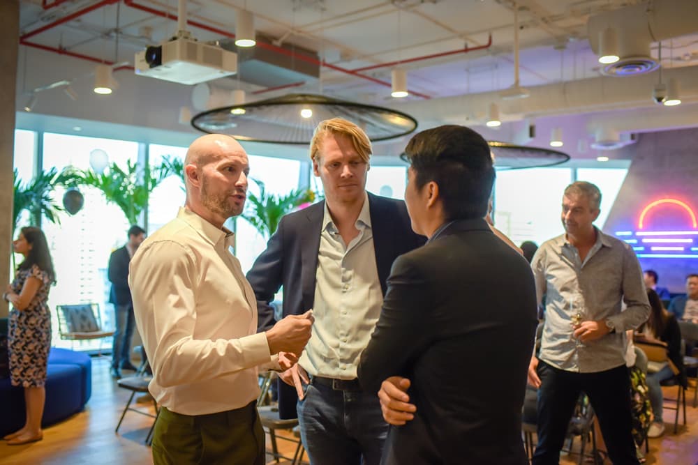 Guests talking at the Bidmath launch event