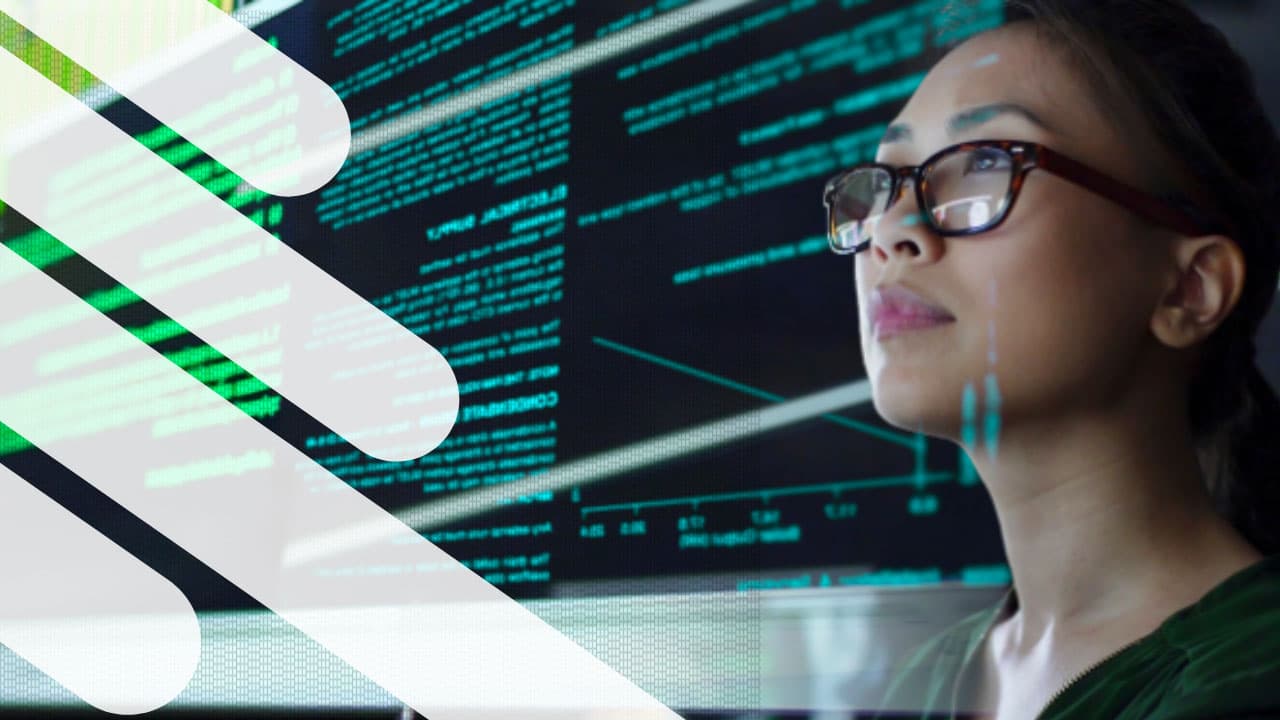 Data scientist looking at code on a screen